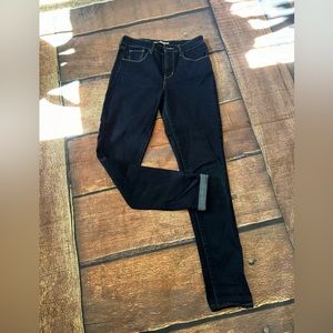 Levi’s women’s size 28. Dark wash. High rise skinny. Red tab.